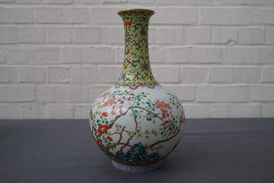 A Chinese famille rose bottle vase with floral design, Jiaqing mark, 19/20th C.